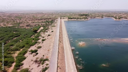 Wallpaper Mural Long embankment of Hub Dam separating the reservoir from the dry desert land Torontodigital.ca