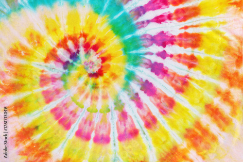 colorful spiral tie dye pattern fabric texture background.
