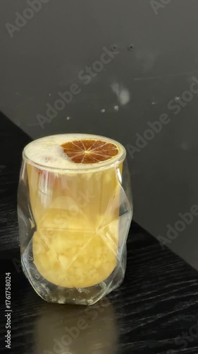 dried orange ginger tea Close-up of herbal tea with ginger and lemon on wooden table 4k