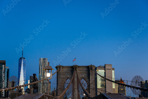 Wallpaper Mural Iconic Brooklyn Bridge Towers Framing the Majestic Manhattan Skyline at dawn with One World Trade Center in New York City Torontodigital.ca