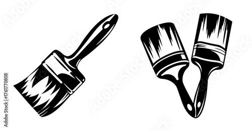 Two classic black and white paint brushes artfully rendered with textured strokes ready for creative use