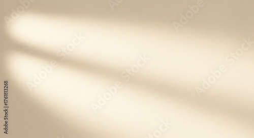 Soft light beams casting diagonal shadows on a plain surface