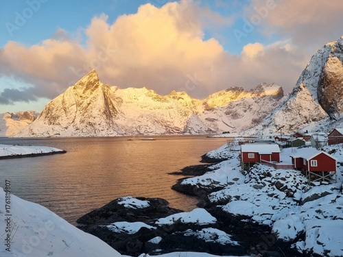 Panorama winter view of Hamnoy or Hamnøy fishing village on Lofoten Islands, Norway. Beautiful sunrise and fishing villages with fjords and mountains in the background.
