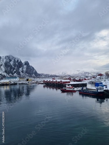 Svolvaer in Lofoten islands during winter, with traditional Norwegian rorbu houses and snowy mountains
