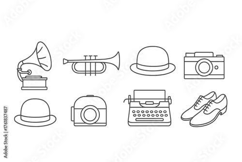 Collection of vintage items including a gramophone, camera, trumpet, and typewriter on a white background