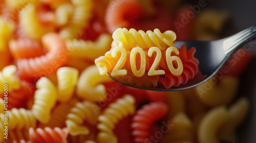Colorful pasta shapes with the year 2026 displayed on a fork against a vibrant background Generative AI