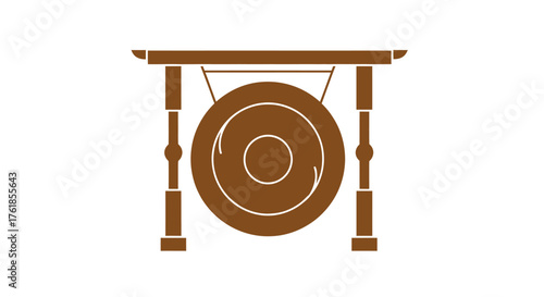 A traditional Asian bronze gong hanging from a decorative wooden stand.