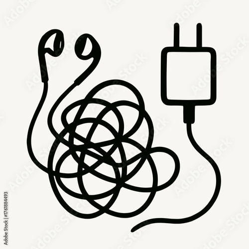 Earbuds tangled beside charger