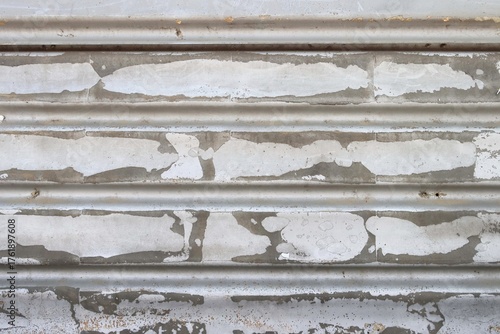 Old metal sheet wall and paint peeling off background