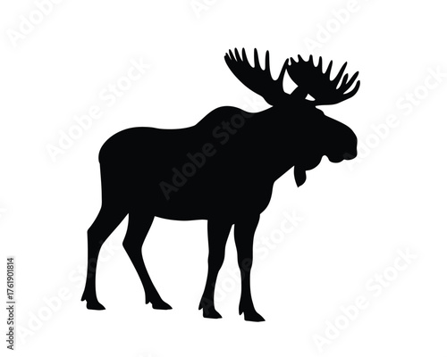 Silhouette of a majestic bull moose with large antlers standing