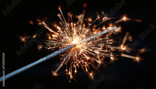 Wallpaper Mural Sparkling celebration with a bright sparkler igniting joy and festive energy against a dark background Torontodigital.ca
