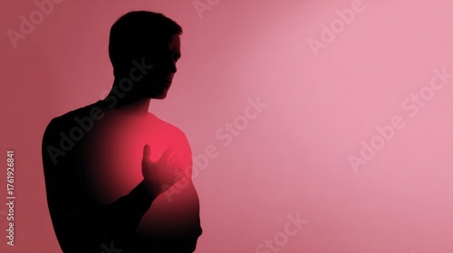 A silhouetted man holds heart aglow in crimson, evoking Valentine's passion and introspective Heart Chakra meditation