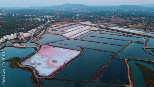 Aerial shot above the salt pans in Algarve region near Tavira and Fuseta village, Ria Formosa natural park, Portugal