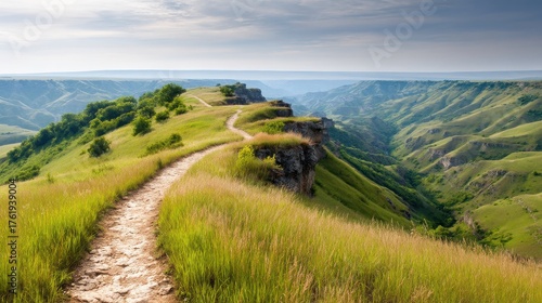 A stunning landscape with rolling hills, a winding path, and lush greenery under a bright sky, showcasing nature's beauty and tranquility.