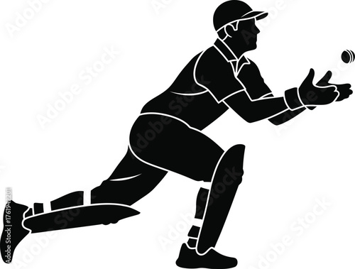 Silhouette of a cricket player catching a ball in mid air