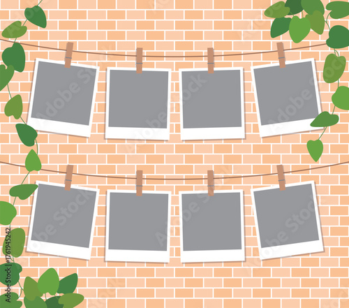 A backdrop featuring blank photo frames hanging on a string with clips against a brick wall. The wall is decorated with ivy, making it perfect for memories, templates, albums, and social media themes.