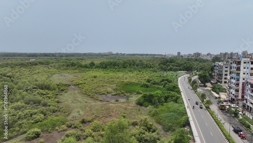 Photography High-resolution aerial photograph showcasing a vibrant coastal city in India, bo