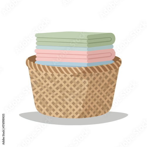 Neatly folded pastel textiles resting in a traditional woven laundry basket, symbolizing household cleanliness and daily routines