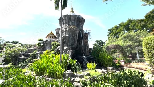 Serene Garden with Rocky Waterfall and Pavilion