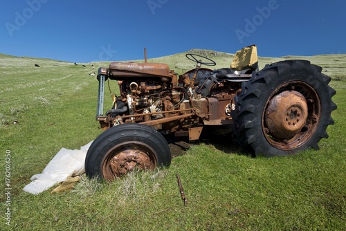 Old rusty tractor standing in a meadow, Mykines, Útoyggjar, Faroe Islands, Denmark