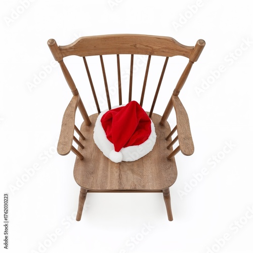 Santa hat resting on wooden chair in minimalist setting  
