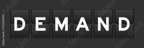 Black color analog flip board with word demand on gray background