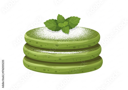 Green matcha pancakes topped with mint leaves and powdered sugar  