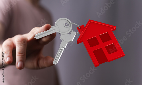 A hand holds keys with a re...