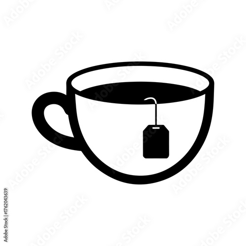 A simple teacup with a tea bag inside ready for a hot drink.