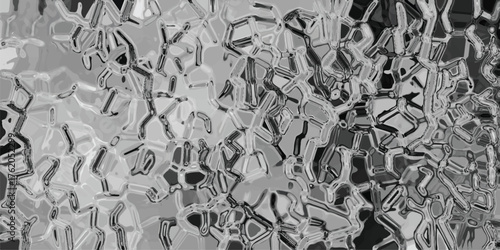 Abstract geometric background with a mosaic of irregular polygons and metallic-like textures in shades of gray and black, suggesting a futuristic or crystalline structure, ideal for technology and