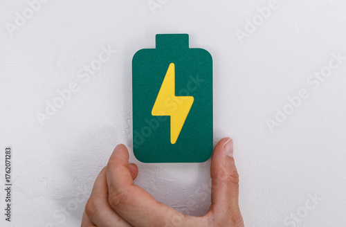 A person's hand holding a g...