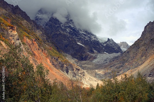Chalaadi Glacier, ice, glacial flour, moraine, and snow in the Caucasus Mountains. Mestia, Svaneti, Georgia.