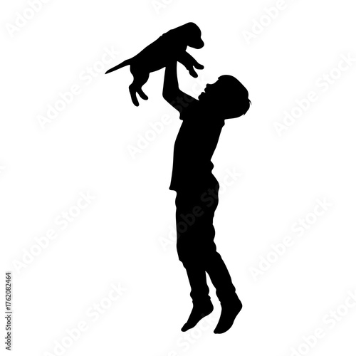 Boy holding puppy in silhouette black