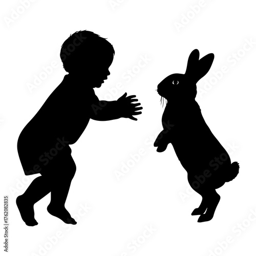 Child reaching for bunny silhouette baby