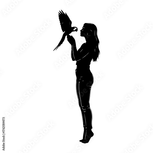 Silhouette woman holding parrot bird
