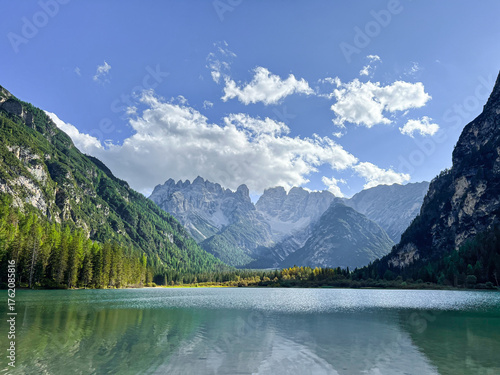 Aerial drone view of Lago di Landro known as Dürrensee lake. Lago di Landro in Dolomites, green alpine lake and trees along the mountain road.Dolomites mountains, Italy.