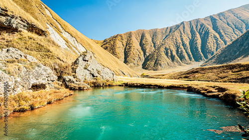 Photos Bubbling turquoise mineral lake in the Caucasus Mountains