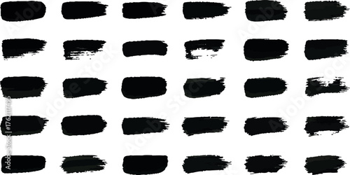 Collection of 30 black grunge brush strokes isolated on for artistic design elements and textures
