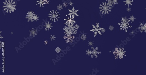 Abstract winter scene of falling snowflakes against a deep blue background, perfect for holiday greetings and winter themes.