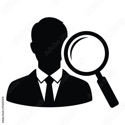 Silhouette of a man in a suit with a magnifying glass