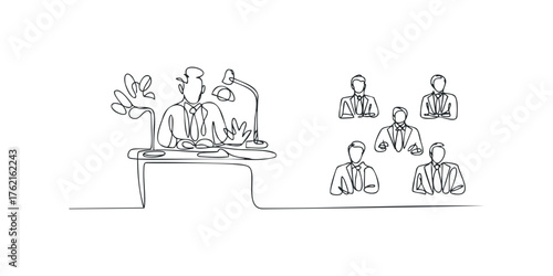 Businessman addressing attentive colleagues in office meeting