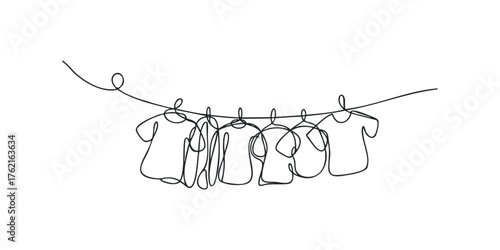Several T-shirts hanging on a clothesline