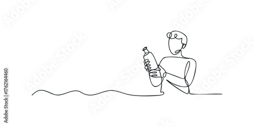 Person holding a bottle with flowing lines