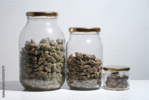 Cannabis drying and curing. Marijuana buds in glass jars. Eco container. Hemp growing concept.