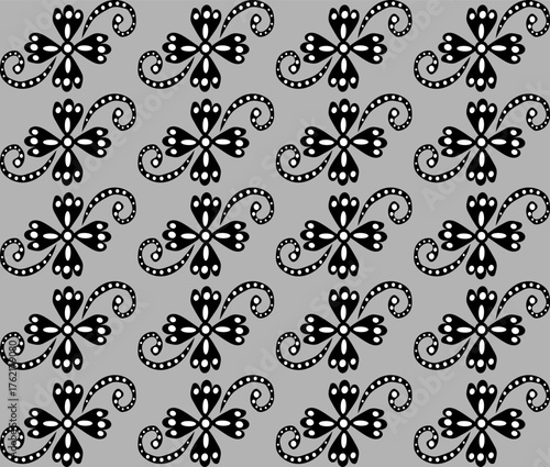 Seamless abstract floral pattern in black and white on a gray background