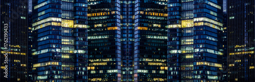 Multi-stories office building at night with worker working overtime. late night at office. lighting and working people within