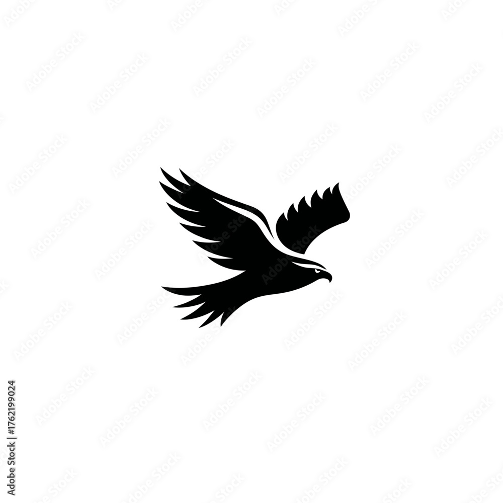 Fototapeta premium Majestic black eagle or hawk silhouette in graceful flight, symbolizing freedom, strength, and power on a clean white background.