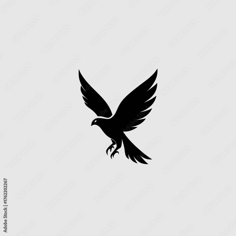 Obraz premium Dynamic black silhouette of a majestic flying bird of prey, like a hawk or falcon, with widespread wings. Vector graphic concept.