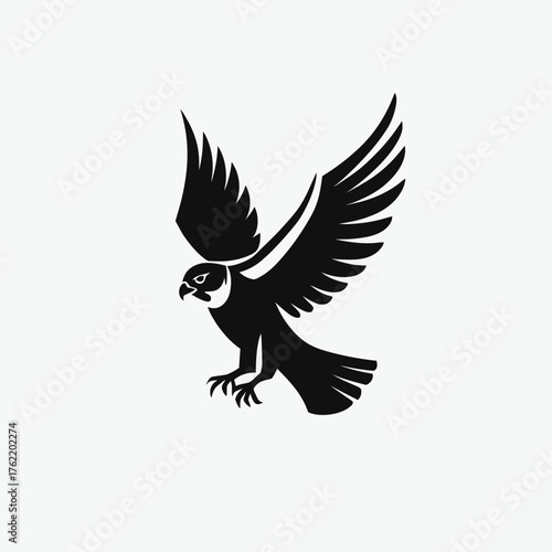 Black falcon or hawk illustration in powerful flight, majestic bird of prey silhouette with spread wings, isolated vector design on white background.