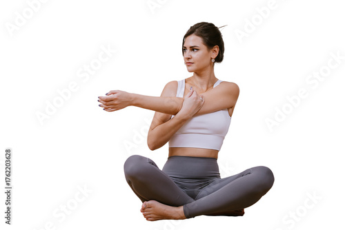 Beautiful American young brunette woman in sportswear sitting on transparent background stretching practicing yoga at home. Focused hispanic female at exercise at fitness club.